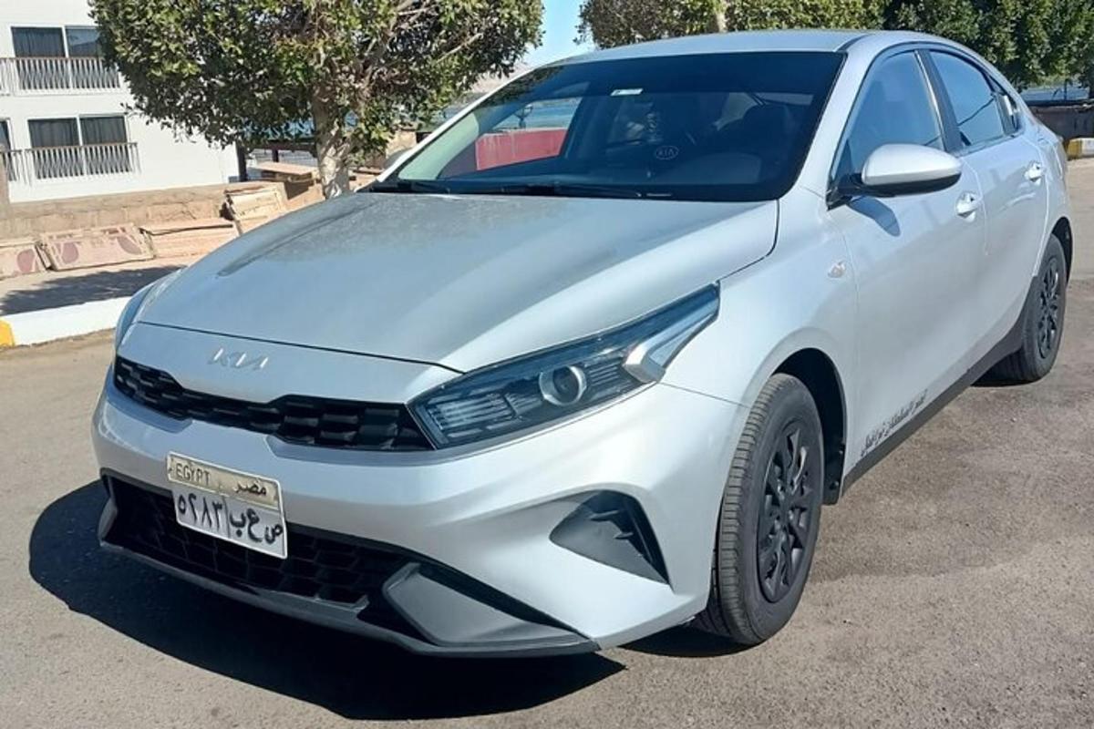 a white car parked in a parking lot