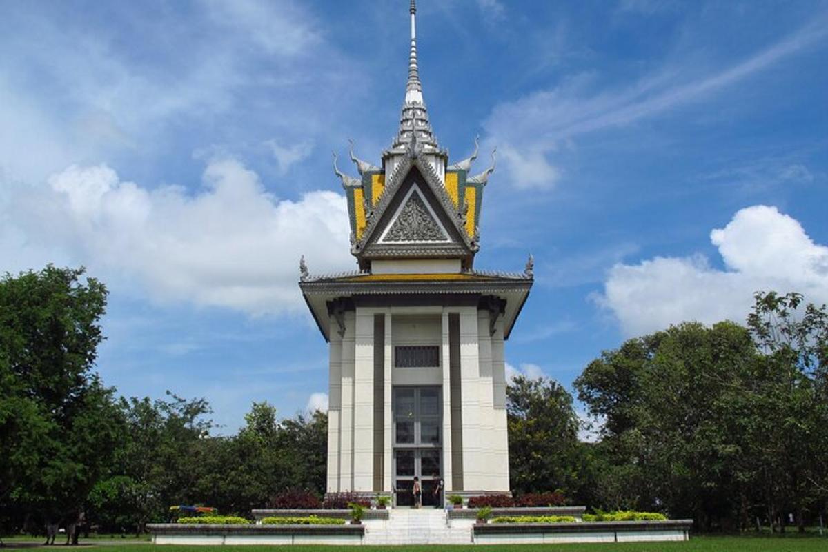 a tower with a steeple on top of a park
