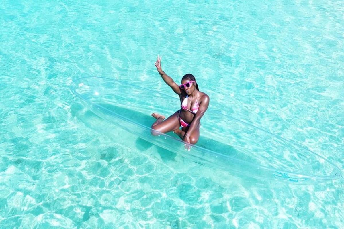 a woman sitting on a surfboard in the water