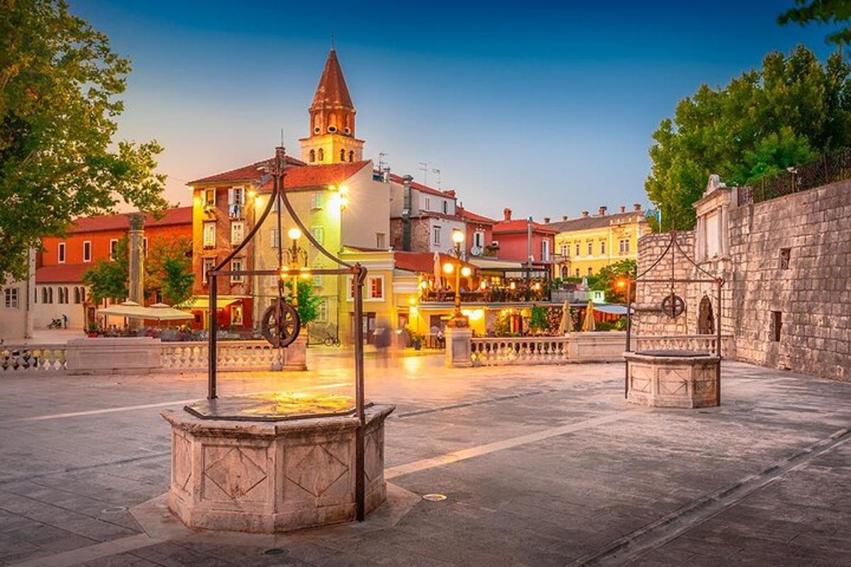 a city square with a building with a clock tower