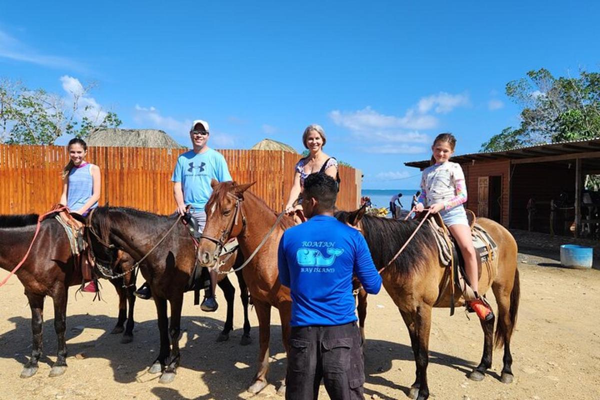 a group of people riding horses with a man