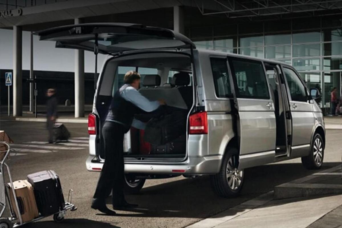 a man getting into a van with its doors open