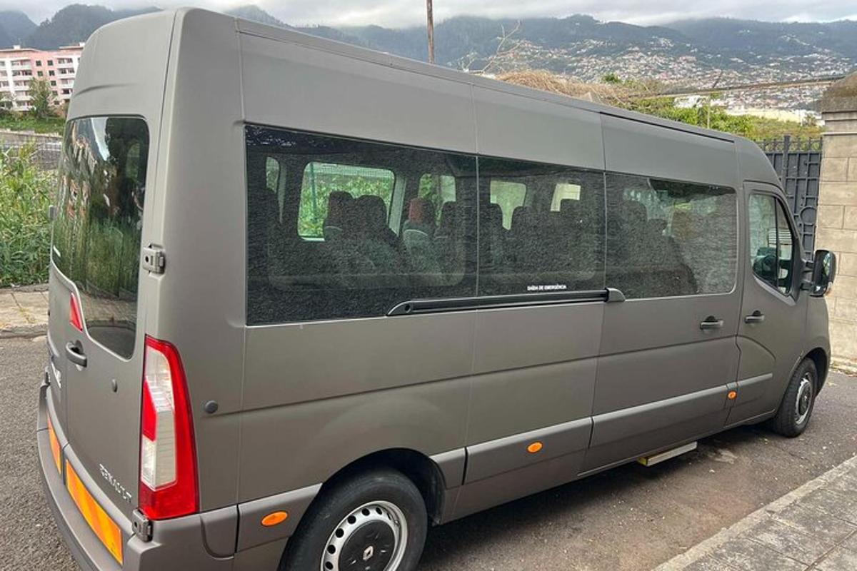 a silver van parked in a parking lot