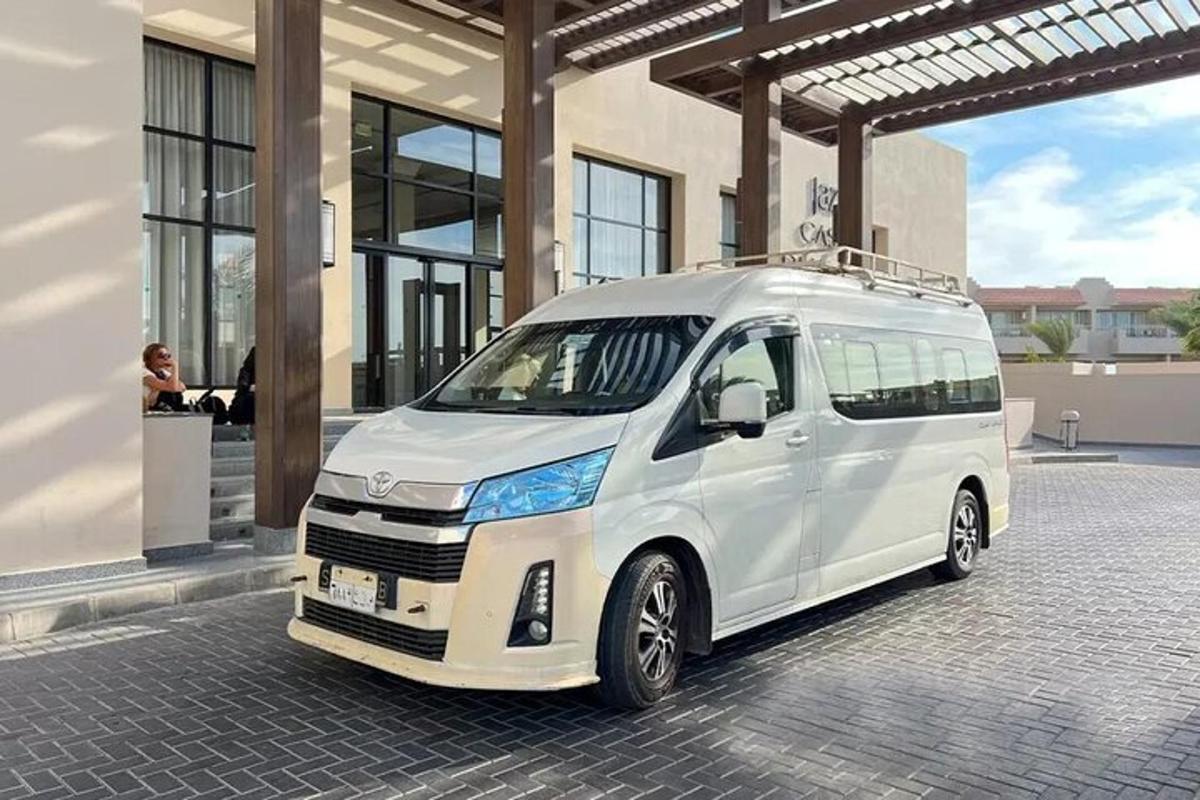 a white van parked in front of a building