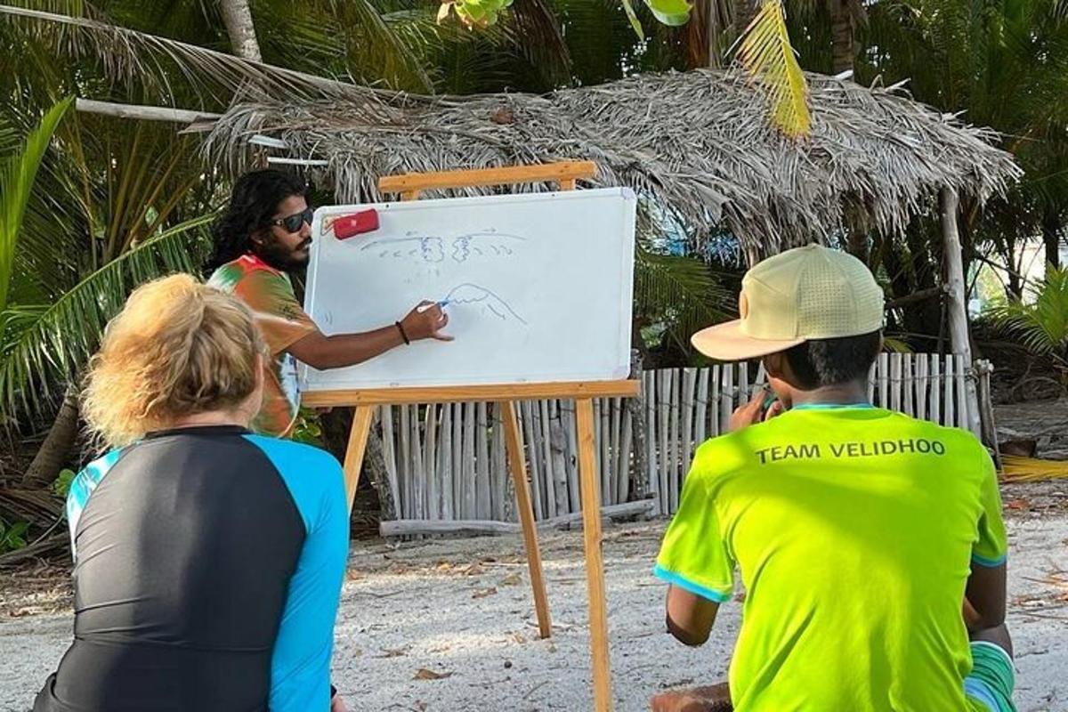 a group of people drawing on a whiteboard