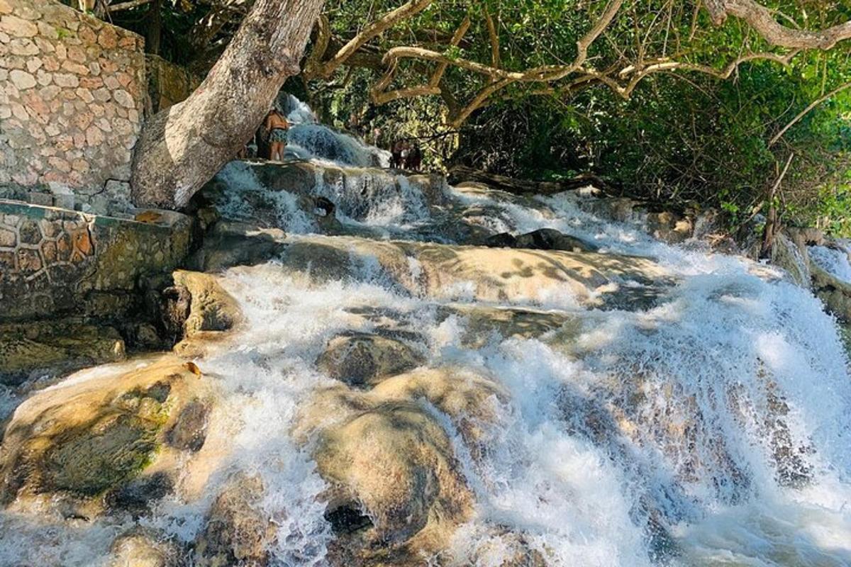 a stream of water rushing over rocks in a river
