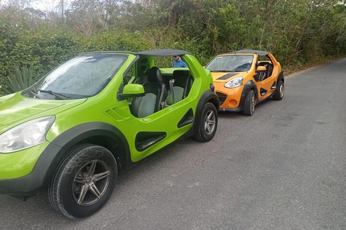 two cars parked next to each other on a road