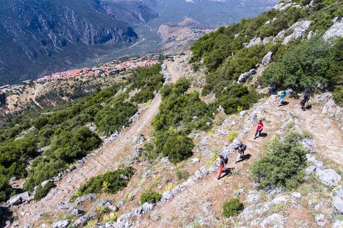 a group of people standing on top of a mountain