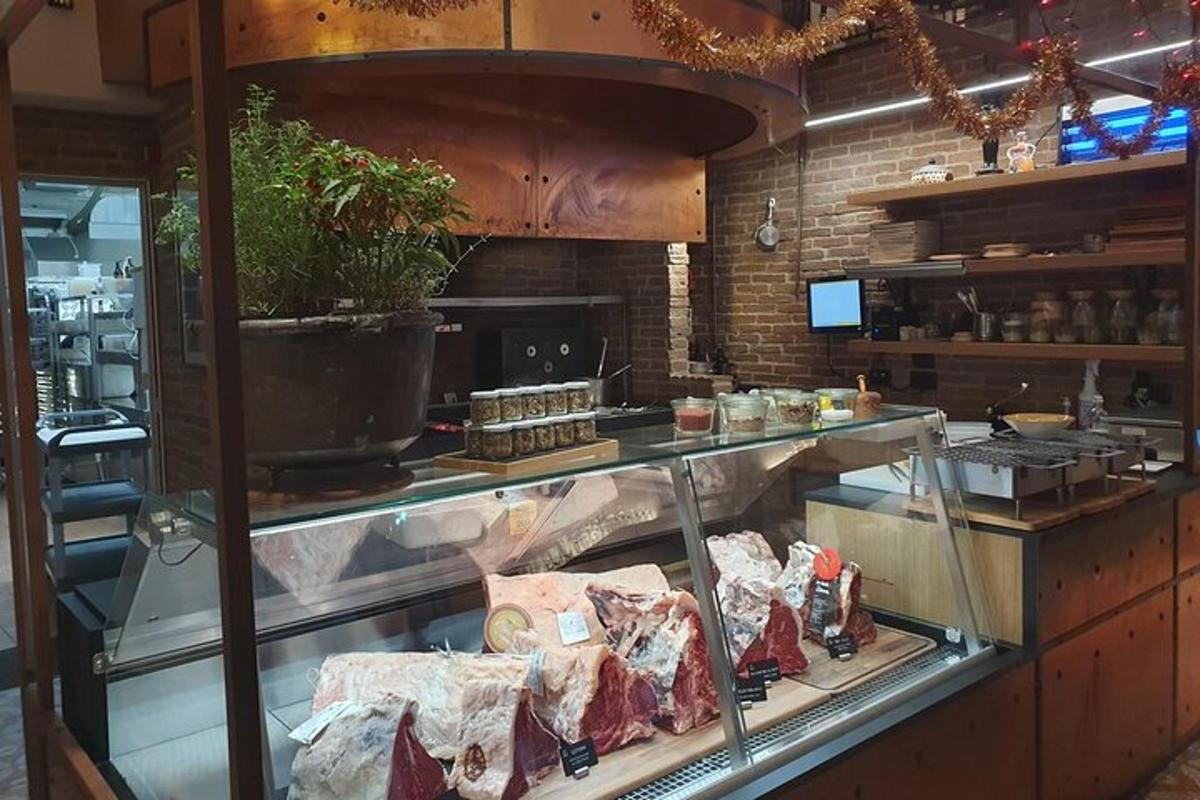 a display case in a restaurant with meat on display
