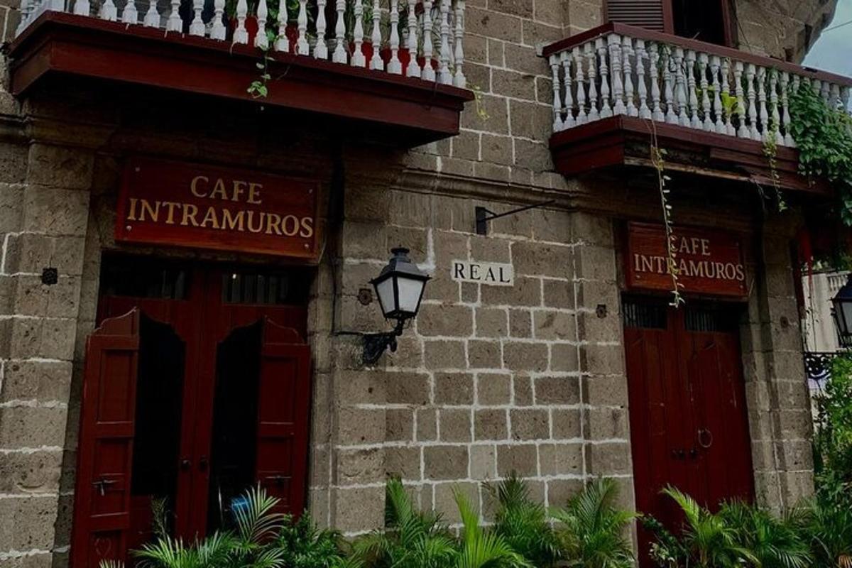 a building with two red doors and a balcony
