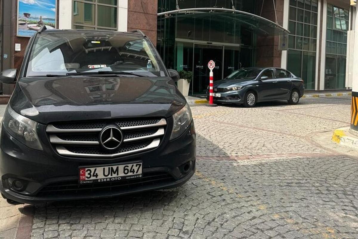 a black car parked in front of a building