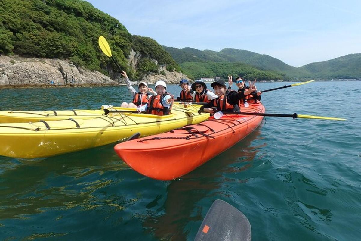 a group of people in kayaks in the water