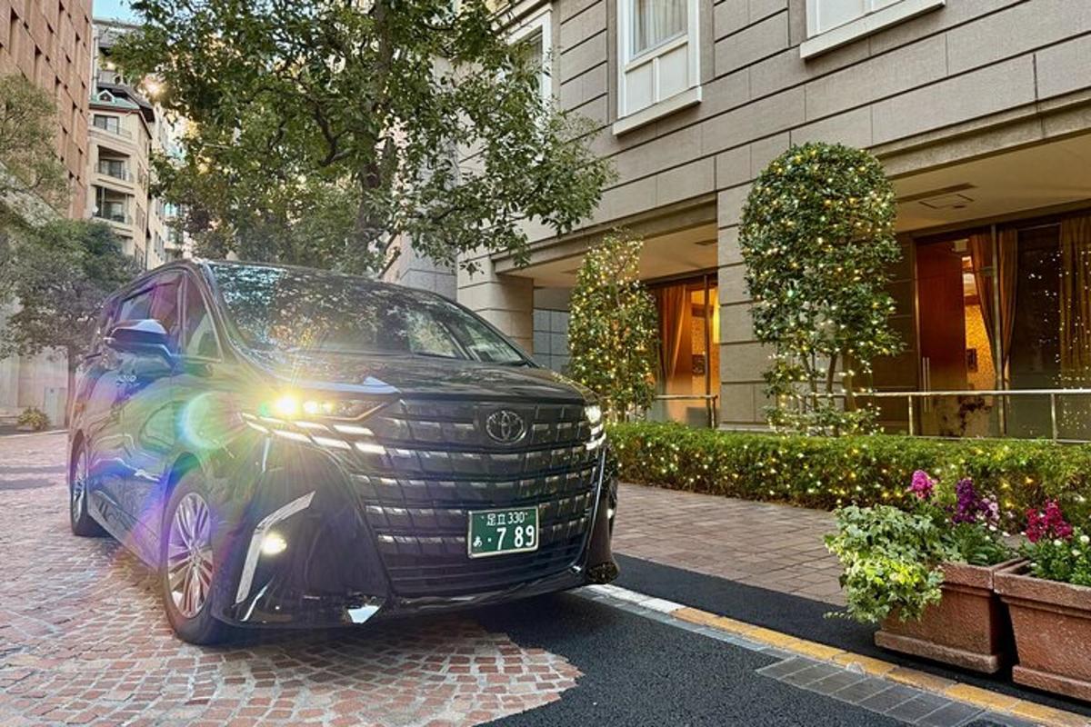 a black car parked in front of a building