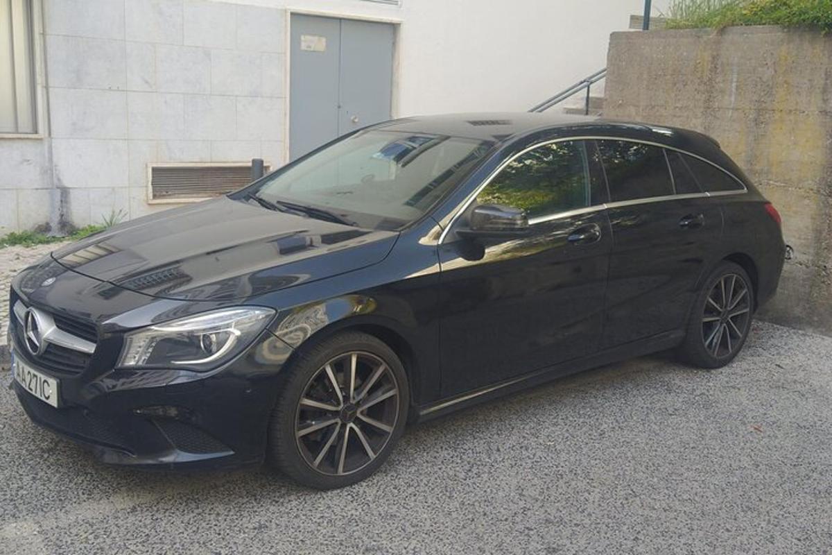 a black car parked in a parking lot