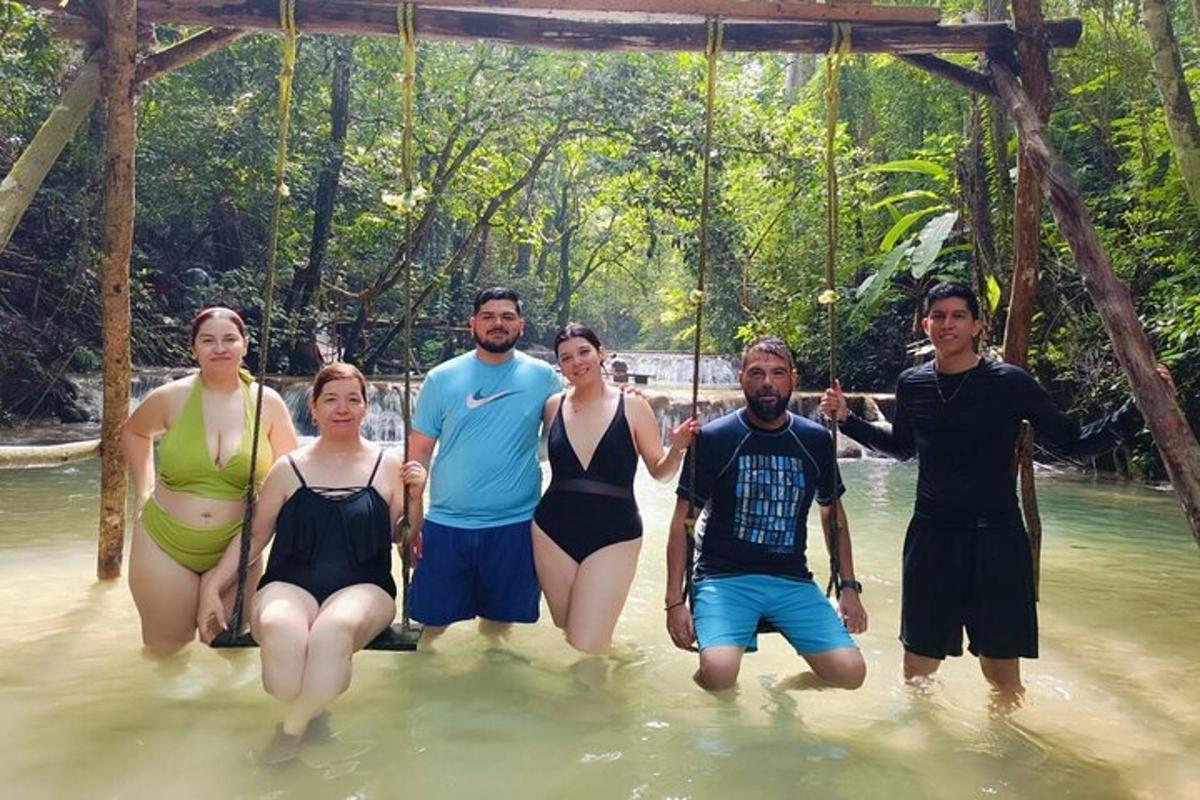 a group of people standing in the water