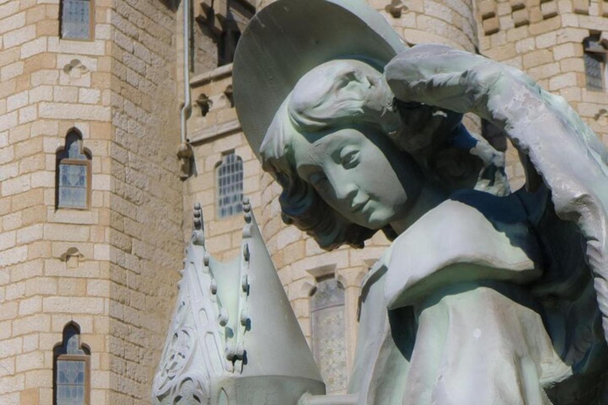a statue of a woman in front of a building