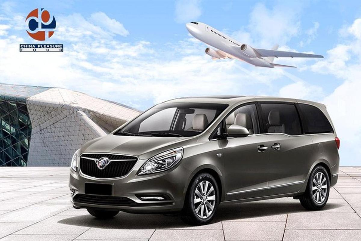 a rendering of a gray car parked in front of an airport
