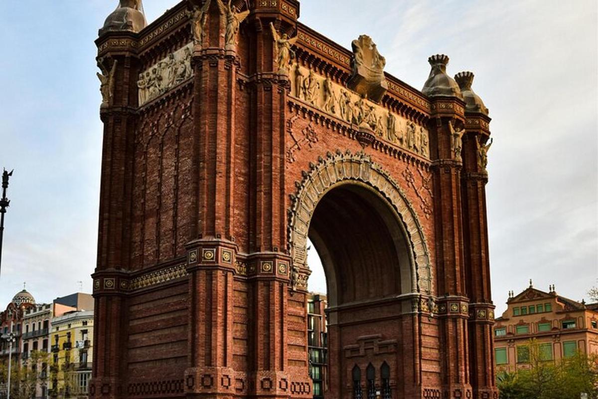a large building with an arch in a city