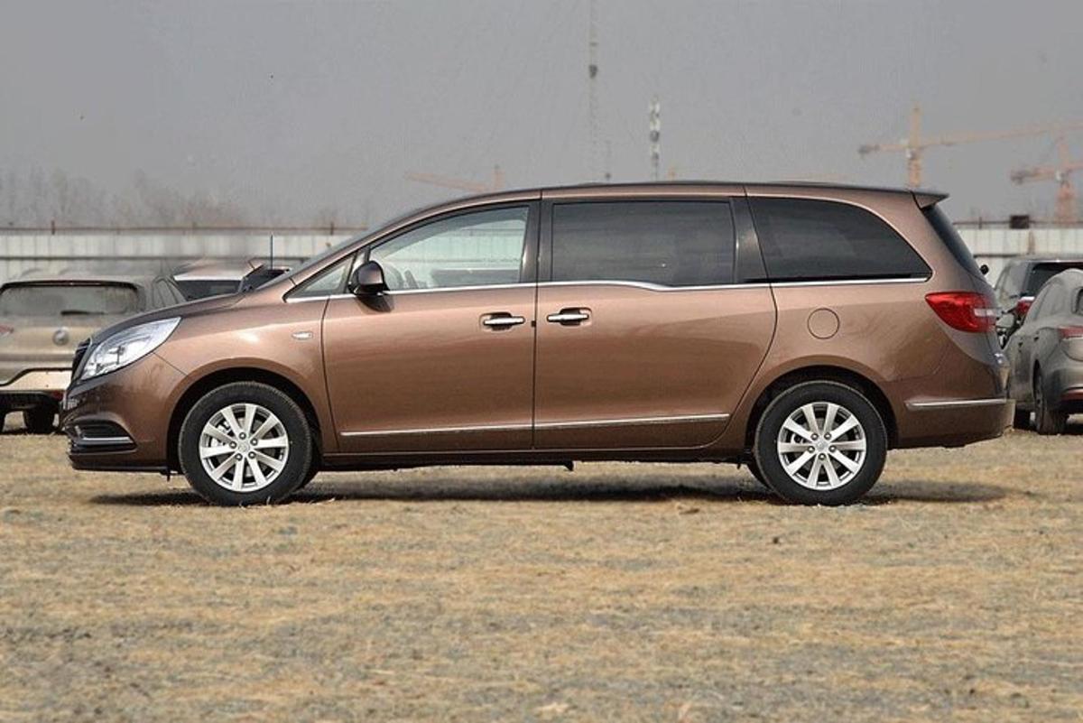 a brown van parked in a parking lot