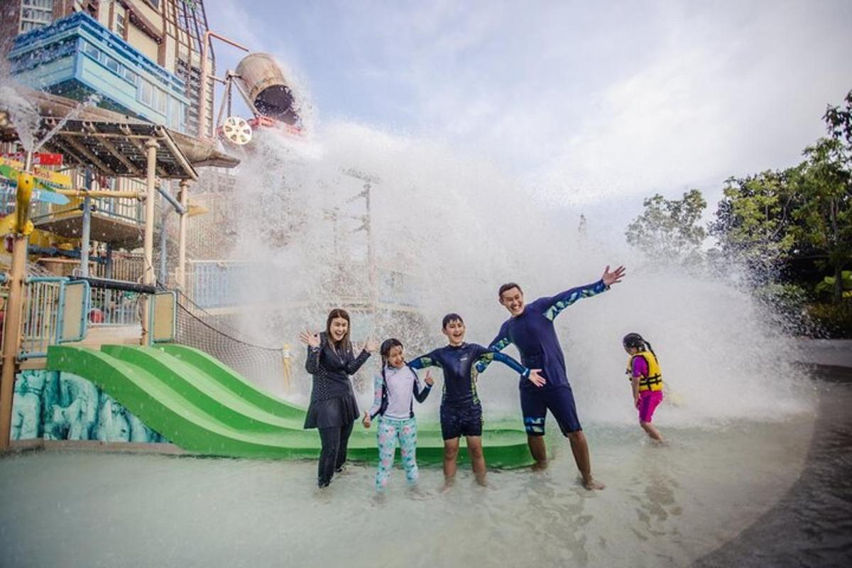 a family standing in the water at a water park