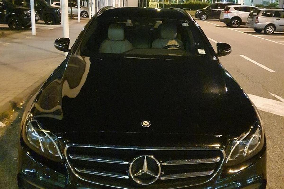 a mercedes benz car parked in a parking lot
