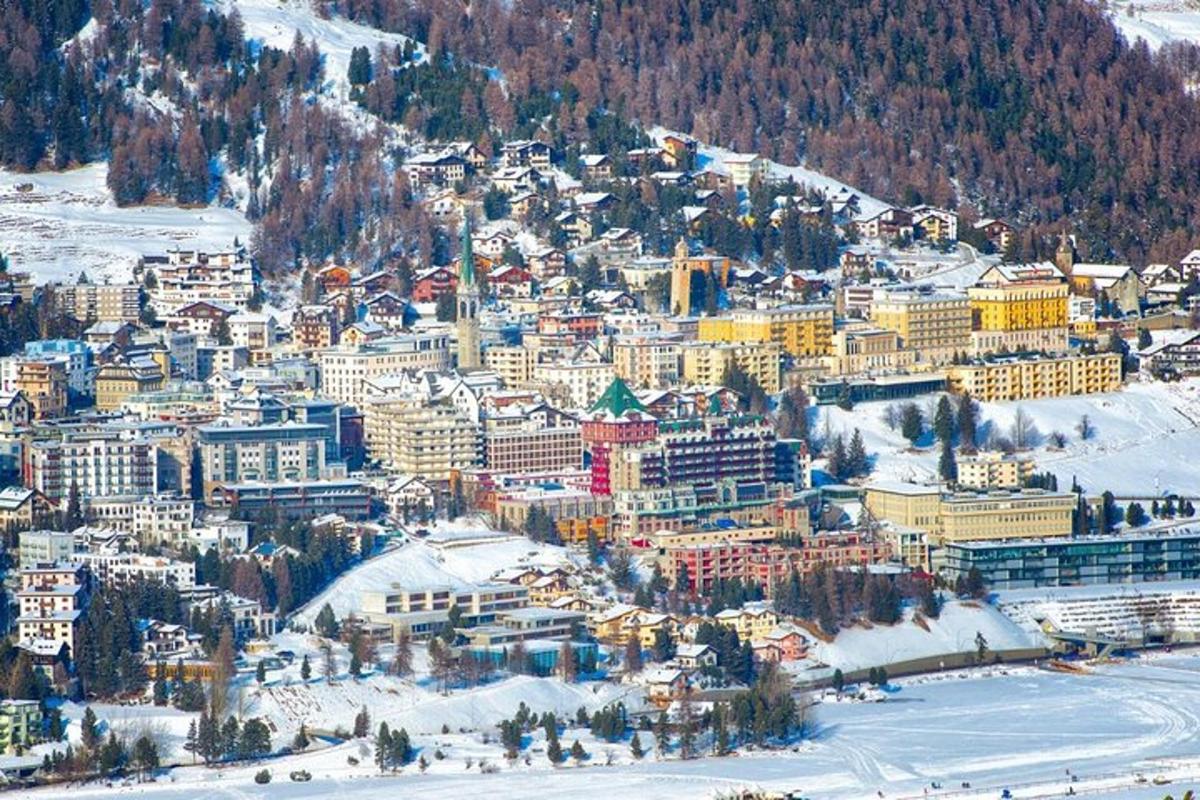 an aerial view of a city in the snow