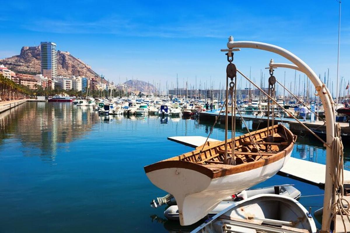 a boat is docked in a marina with other boats