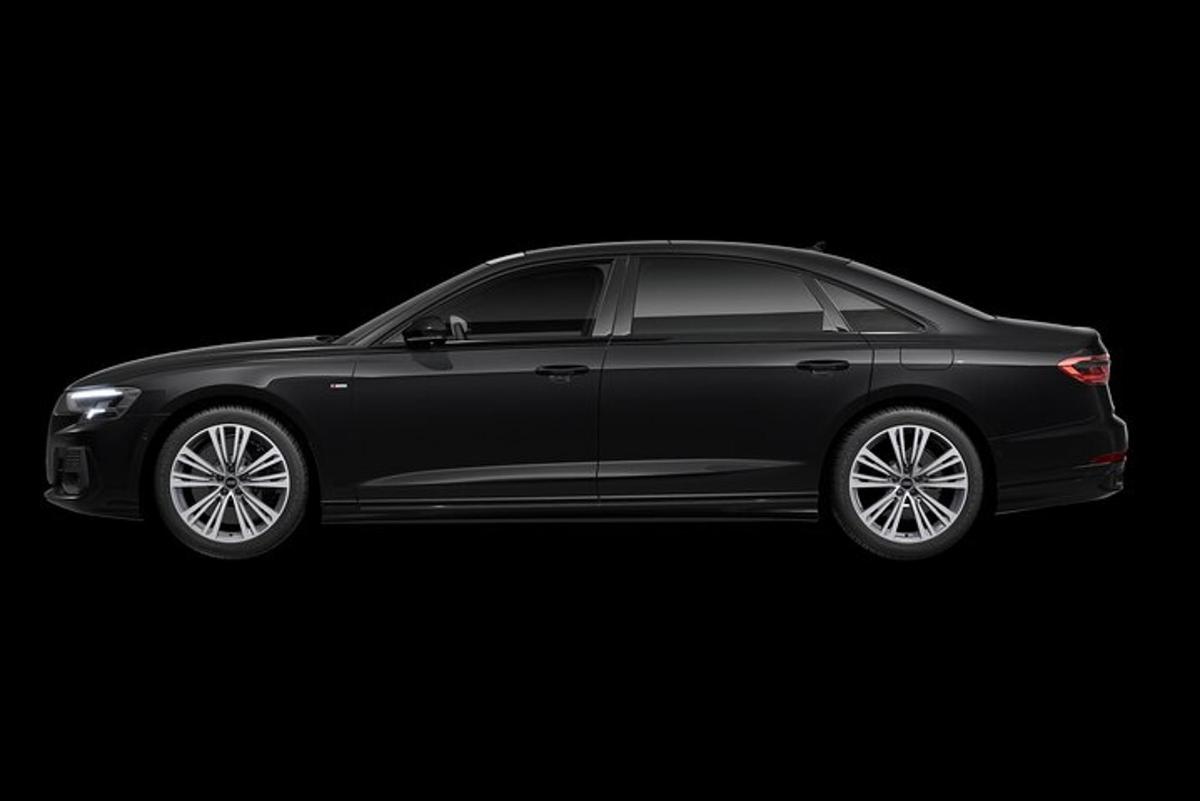 a black car parked in a black background