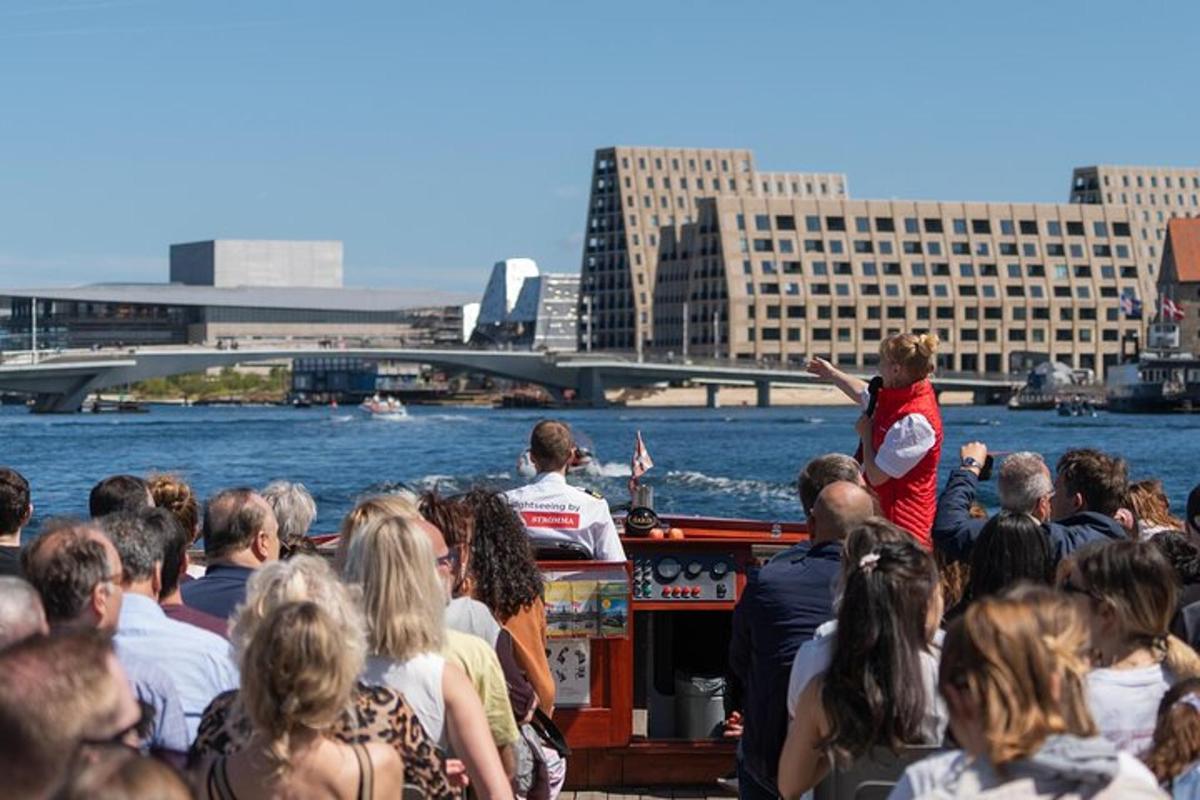a crowd of people on a boat in the water