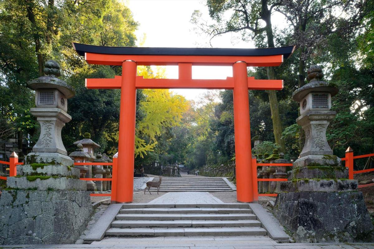 an orange torii gate in a park with stairs