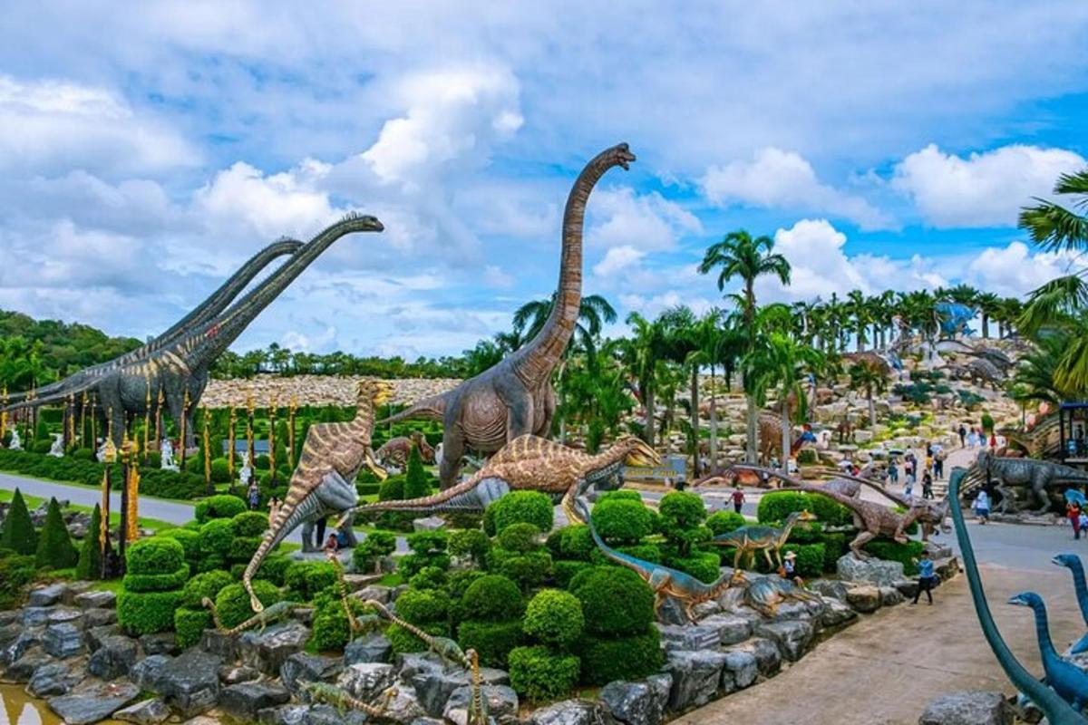 a display of dinosaur statues in a park