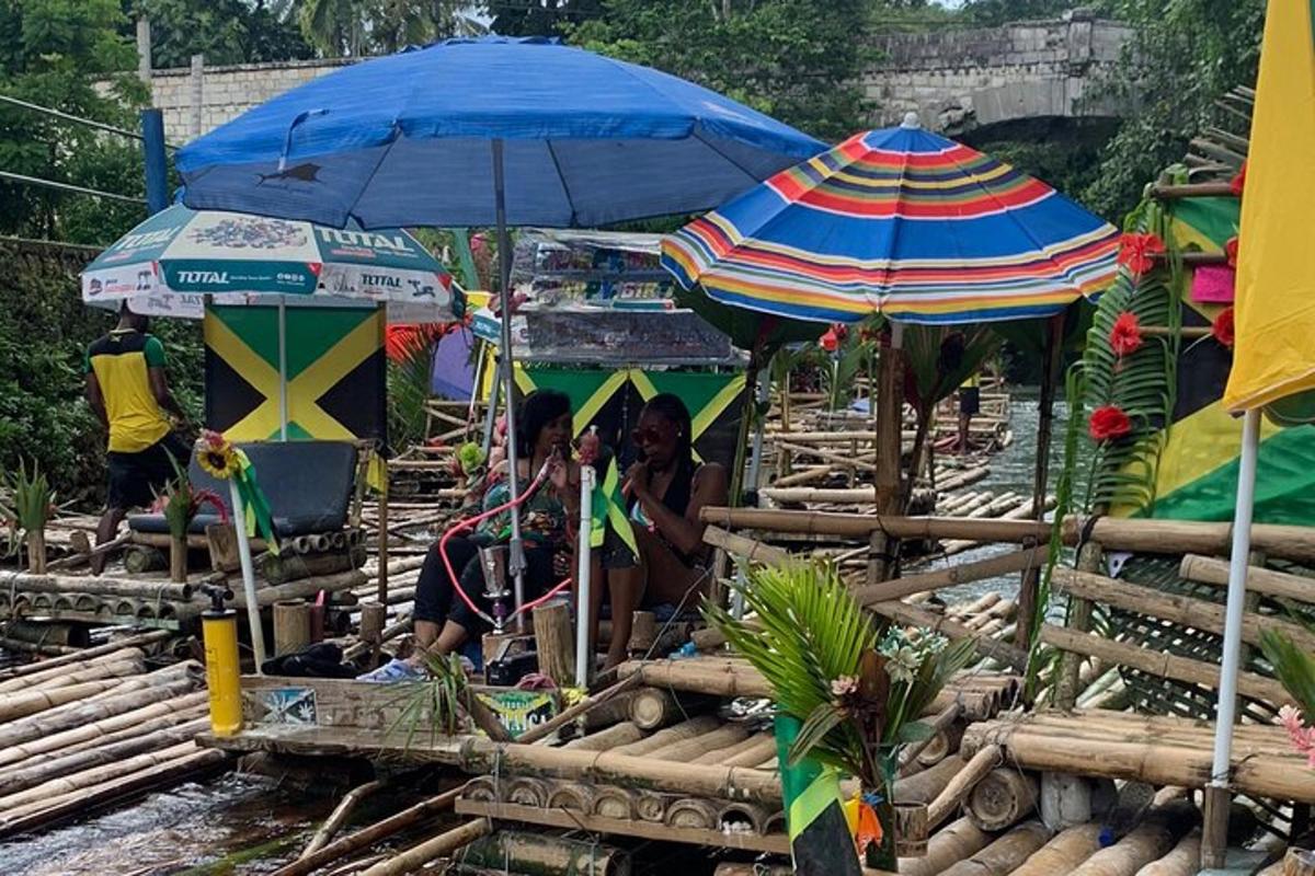 a group of people sitting under umbrellas on a raft