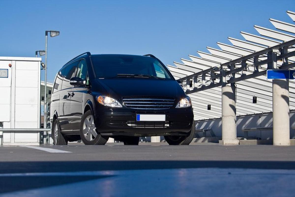 a black and white van parked in a parking lot