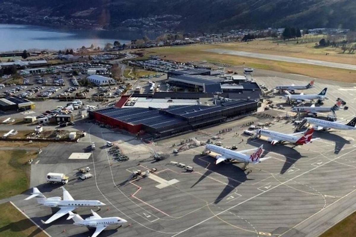 an aerial view of an airport with airplanes parked