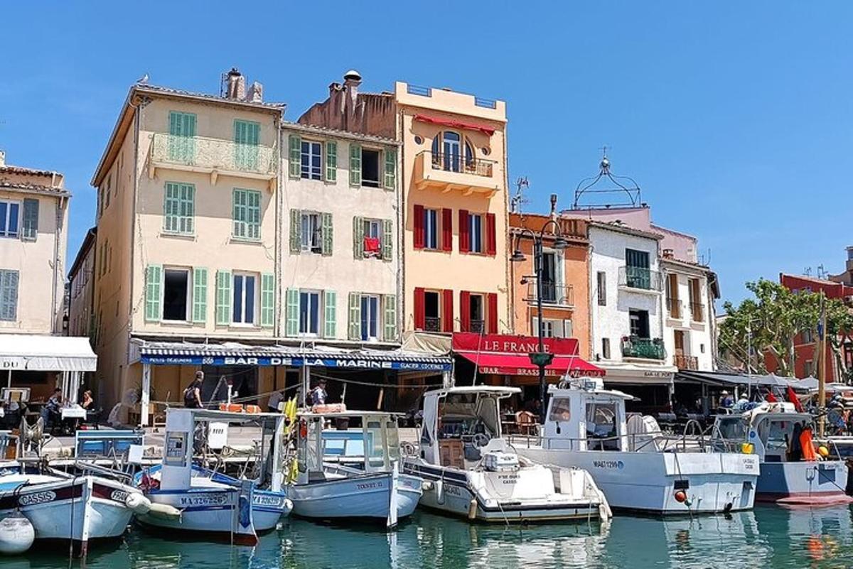 a group of boats docked in a harbor with buildings