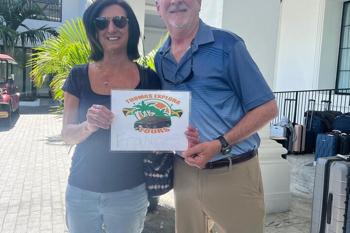 a man and a woman holding up a sign