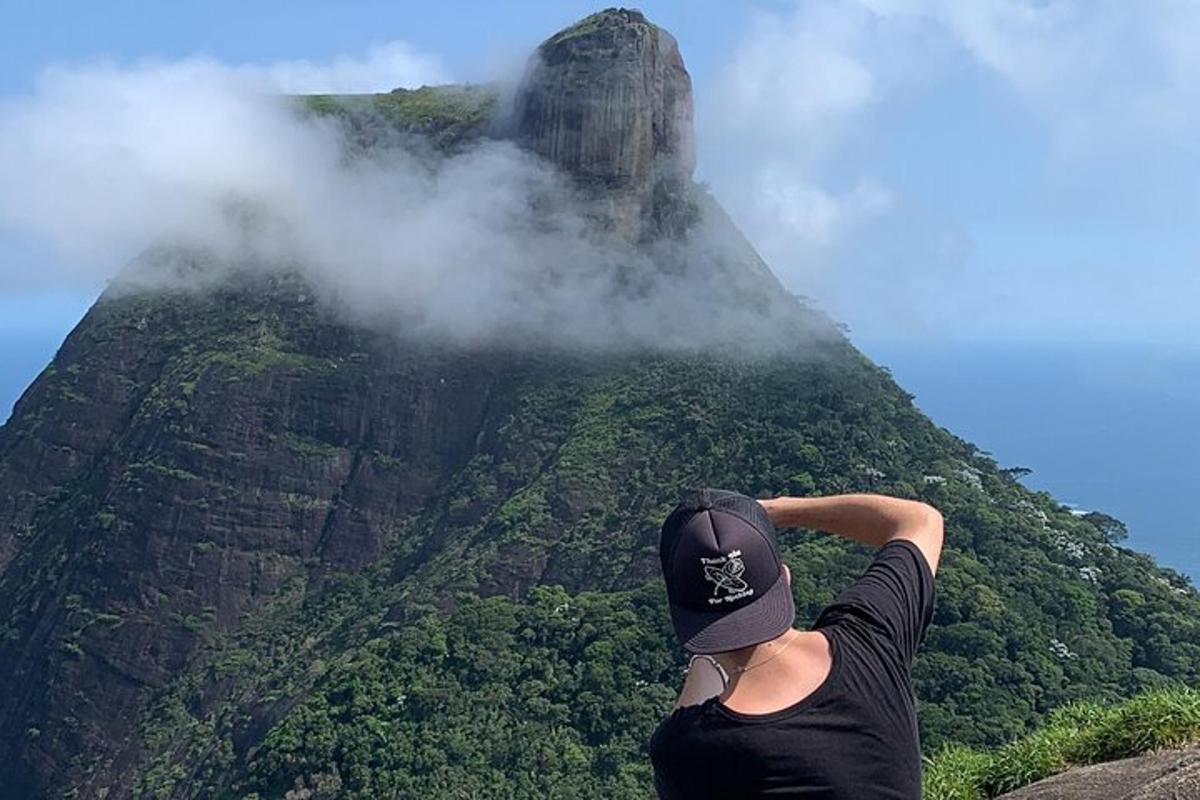 a man taking a picture of a mountain