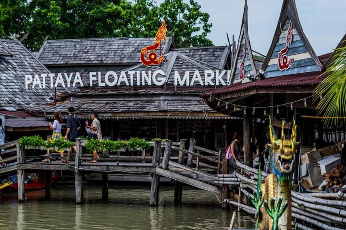 a building on the water in front of a market