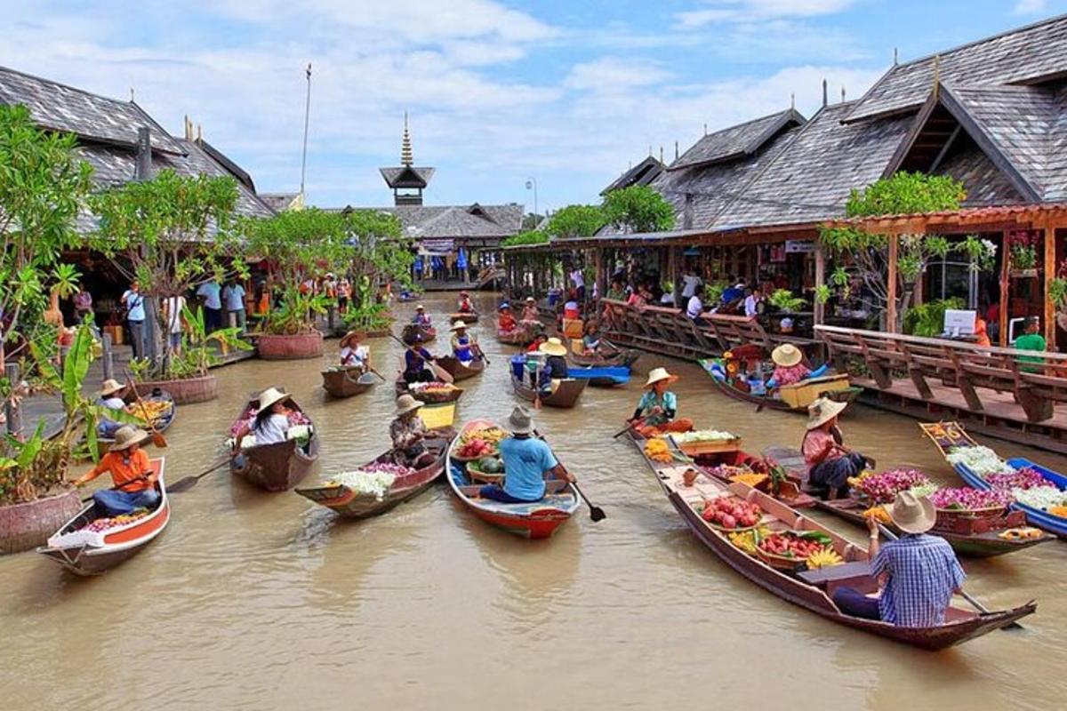 a group of people riding in boats down a river