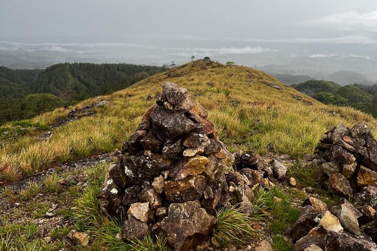 a pile of rocks sitting on top of a hill
