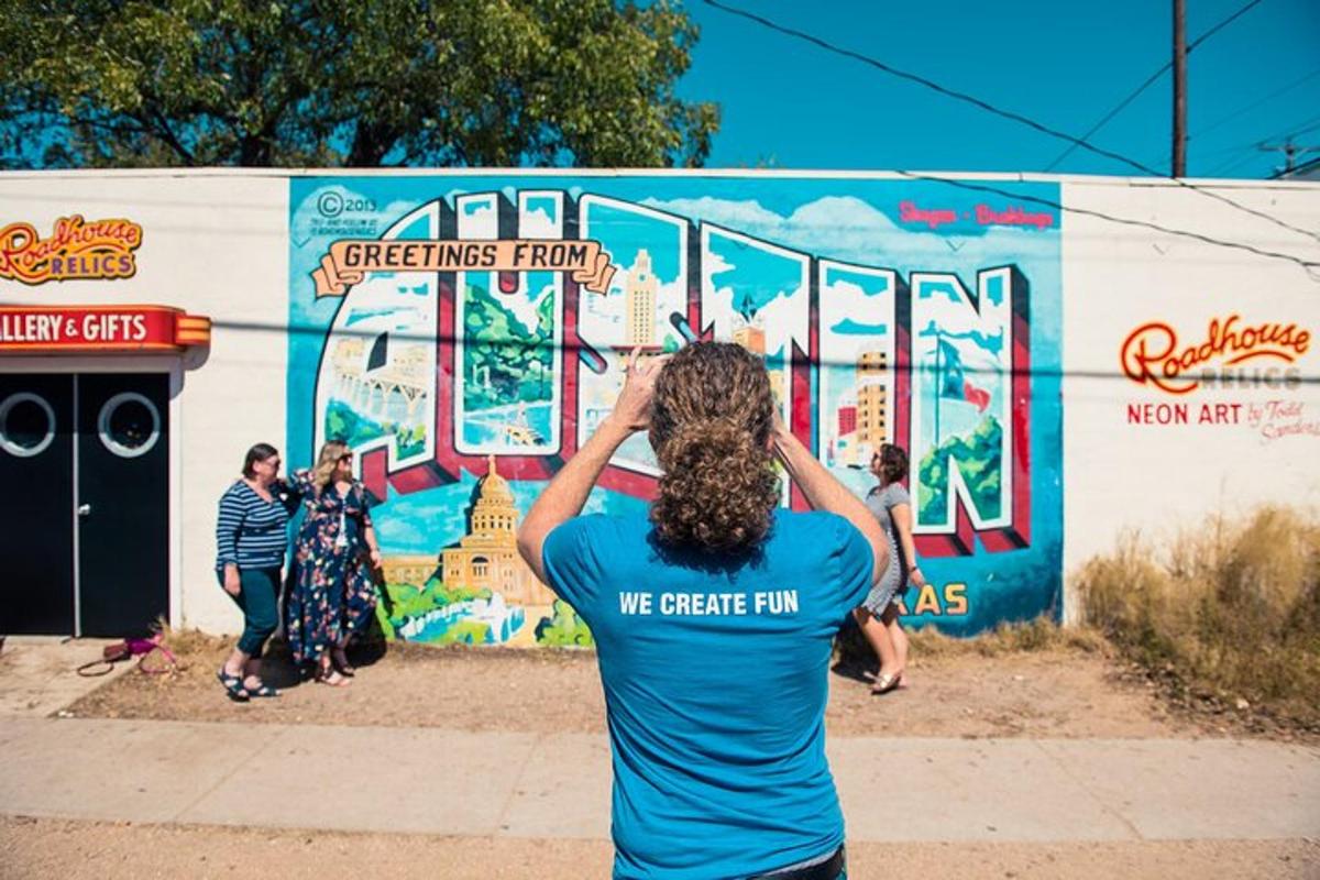 a person standing in front of a mural on a wall