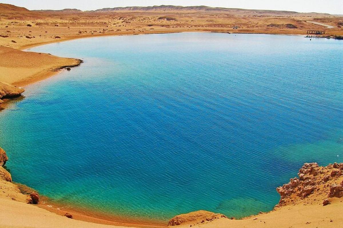 an aerial view of a large pool of water in the desert