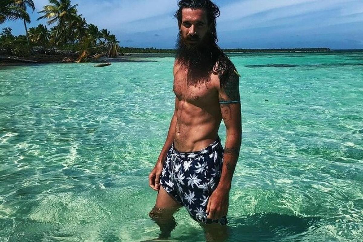 a man standing in the water in the ocean
