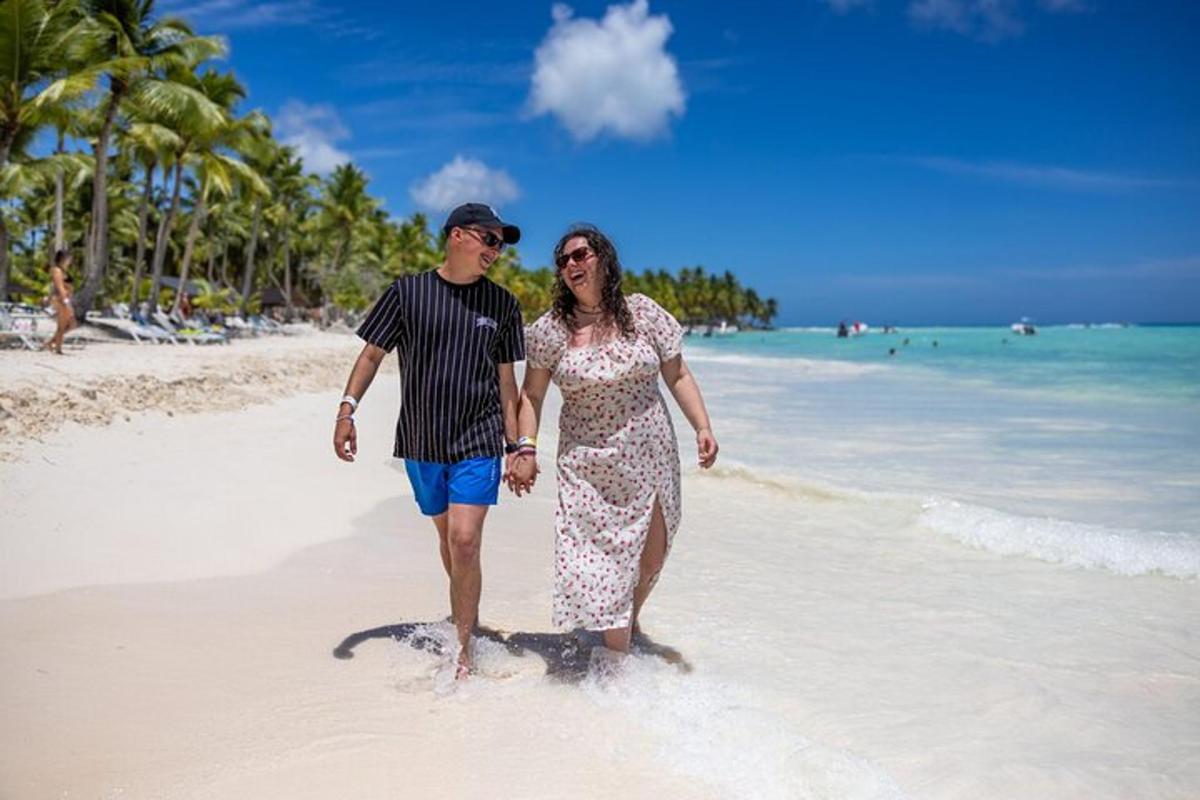 a man and a woman standing on a beach