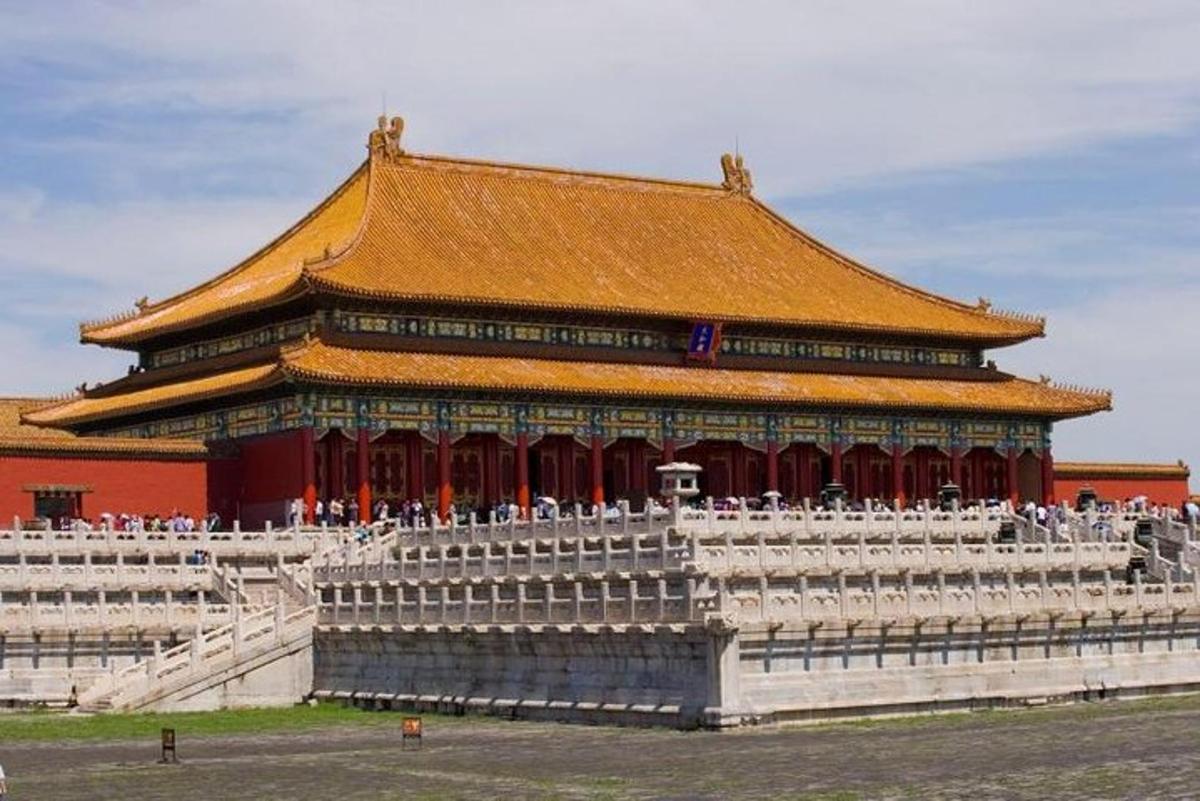 a large building with people standing in front of it