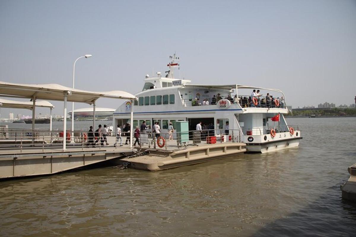 a large ferry boat is docked at a dock