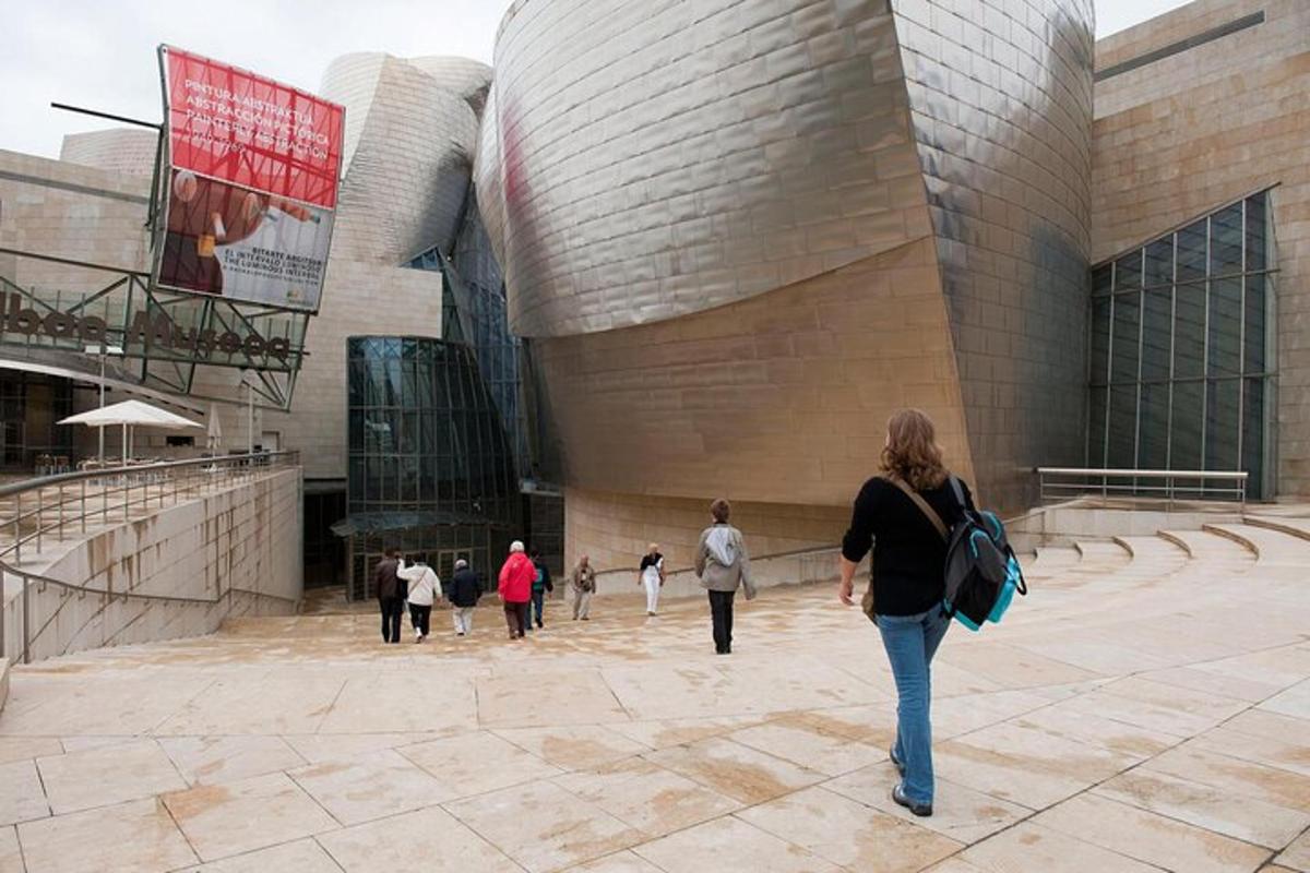 a group of people walking in front of a building