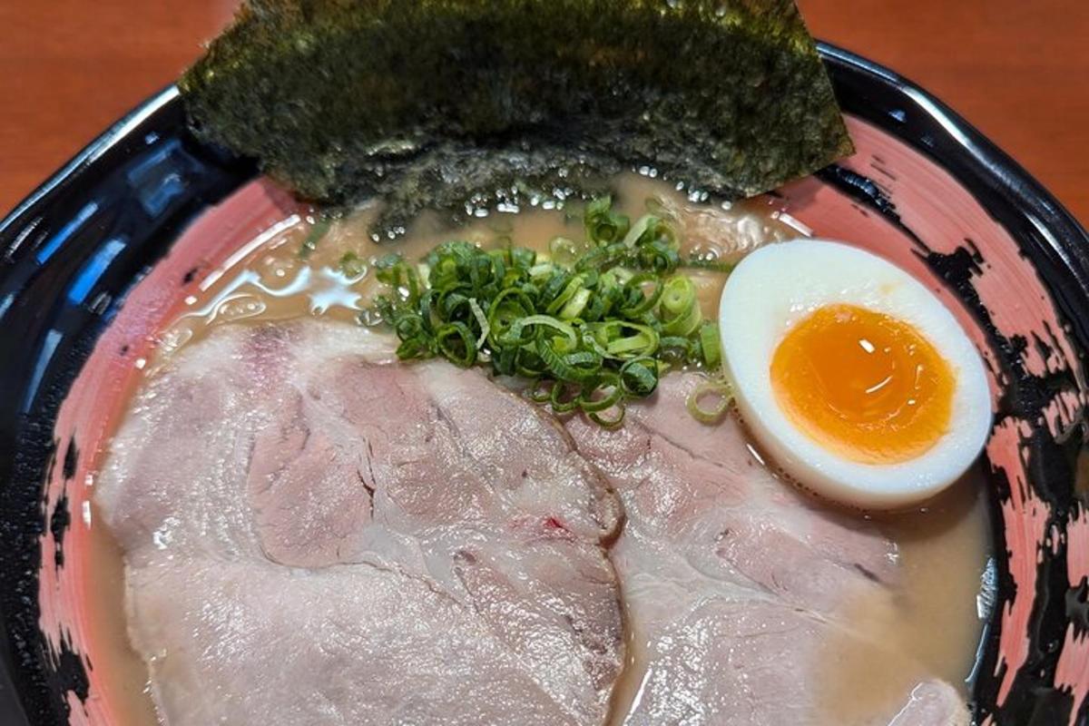 a plate of food with an egg and meat
