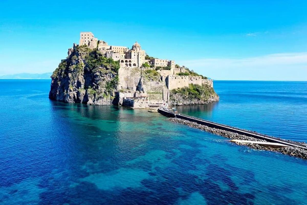 an island in the ocean with a castle on it