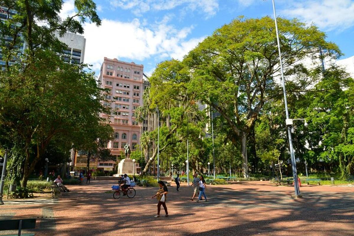 a group of people walking around in a park